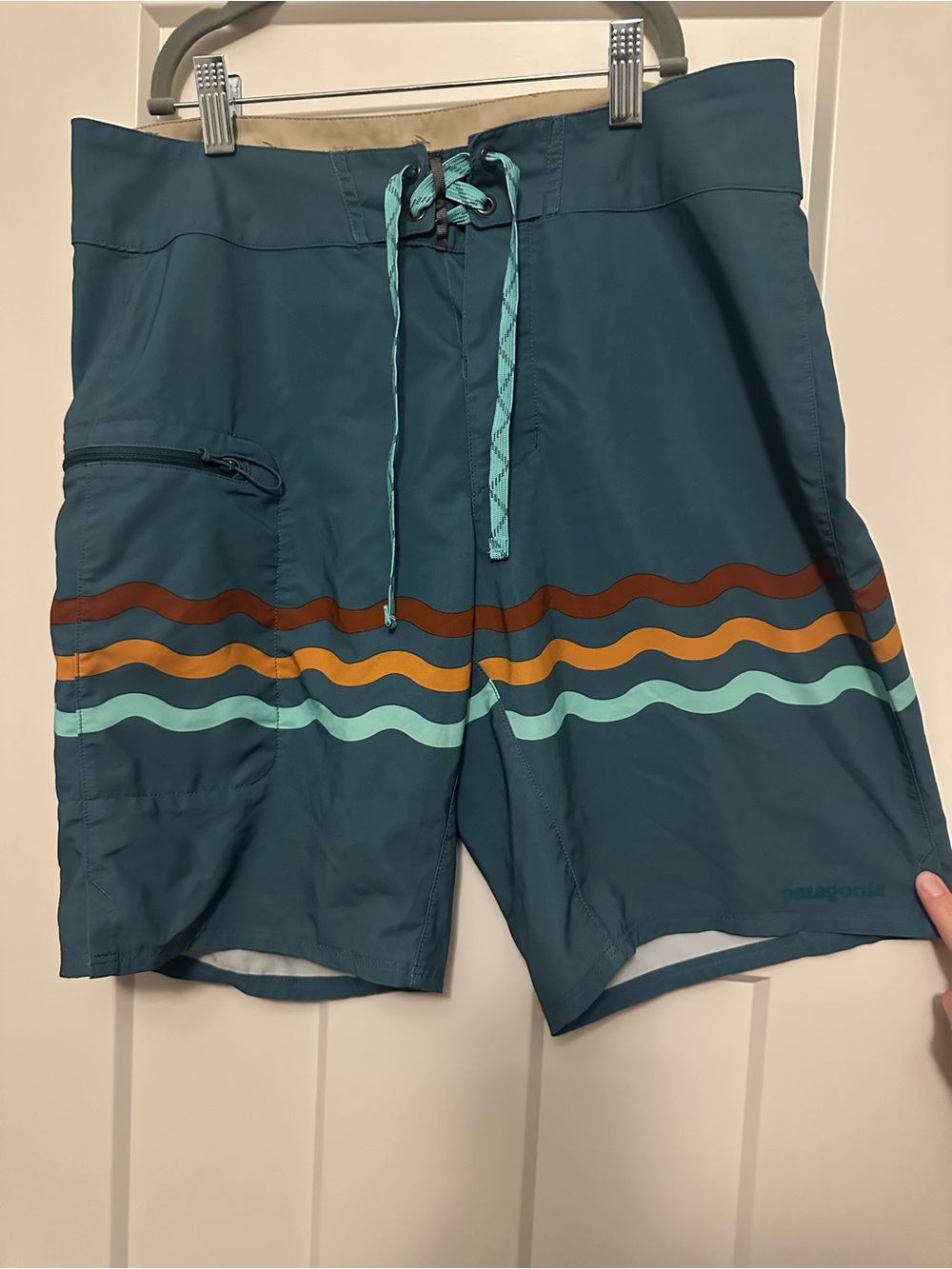 Patagonia Teal Board Shorts with Multicolor Wave Stripes
